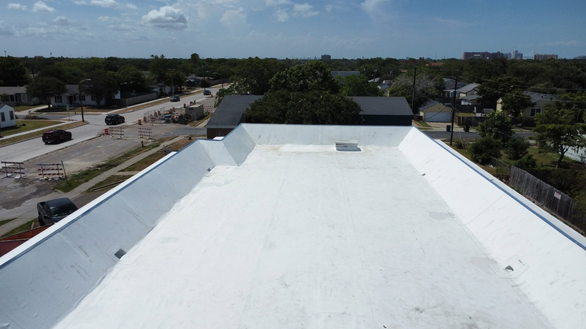 Commercial re-roof work in progress by Unique Roofing